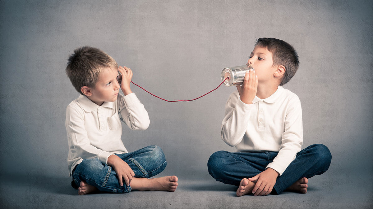 Effective Communication with the IEP Team Matters, image of two children communicating through tin cans.