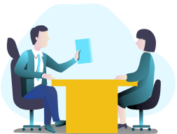 Special Education Consultation, image of two people sitting at a table talking.