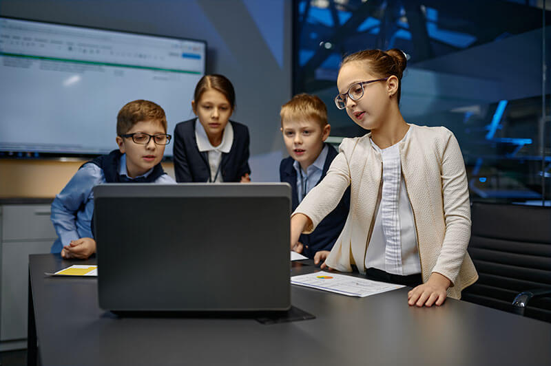 Brightside Law Group Team, image of children in a business setting looking at a laptop together.